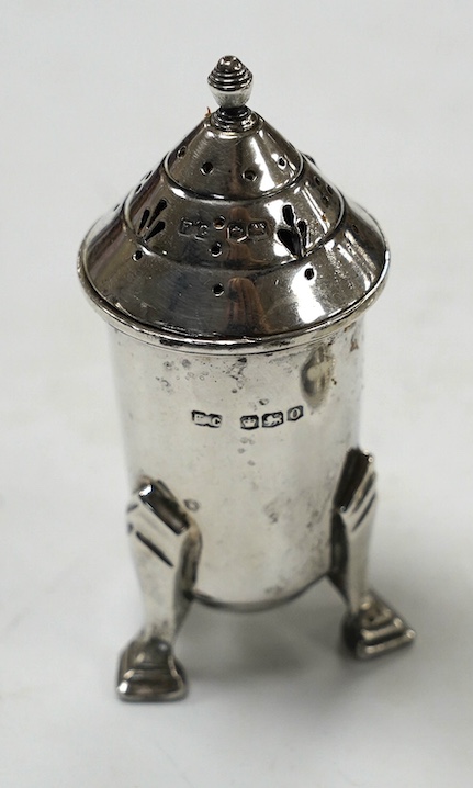 A George V matched silver three piece condiment set, London, 1931(2) and 1933, together with two other silver condiments. Condition - poor to fair